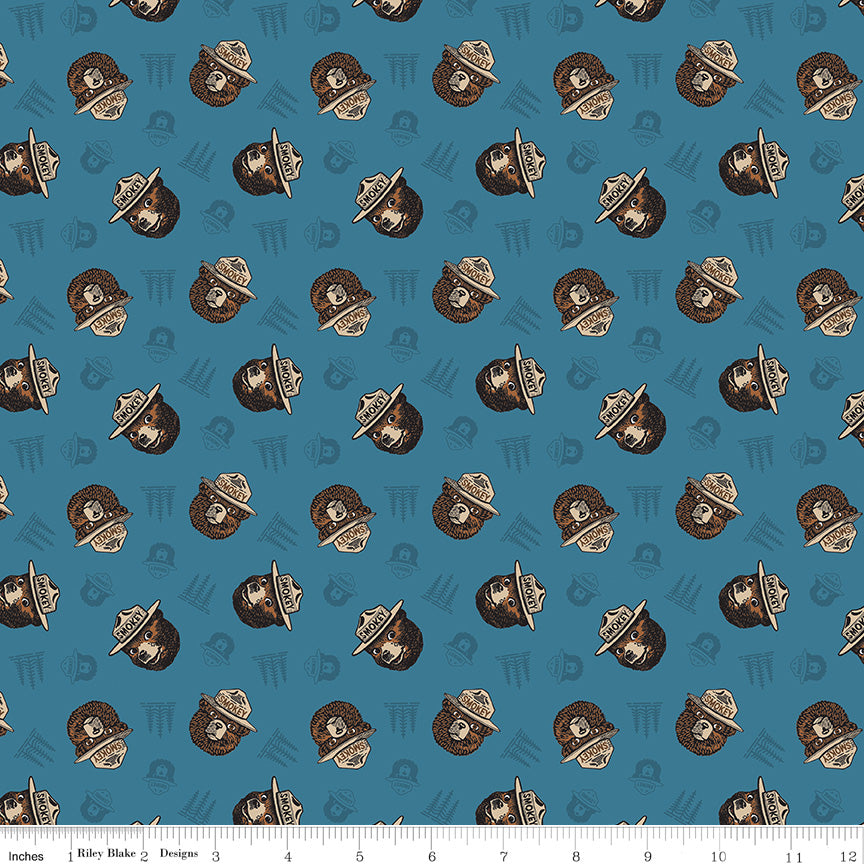 Only You Smokey Toss Cadet Cotton Licensed Yardage | Riley Blake Designs - Smokey Bear tossed on cadet blue background