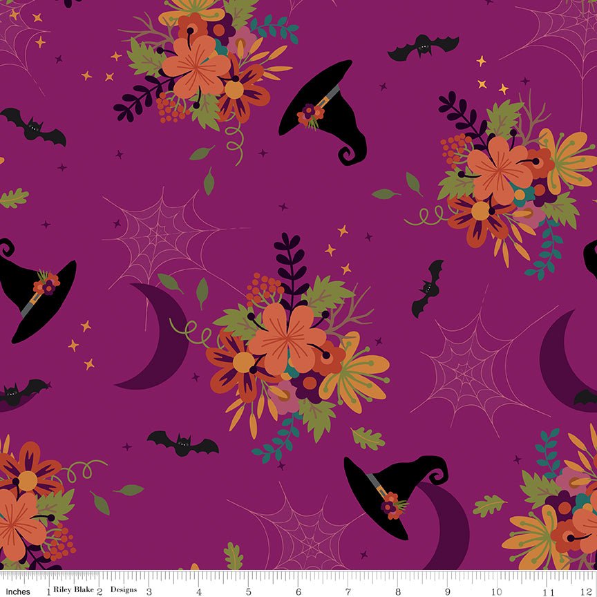 Little Witch Main Magenta Yardage by Jennifer Long | Riley Blake Designs magenta fabric with scattered witches hats, spider webs, moons, bats, flowers, stars and more
