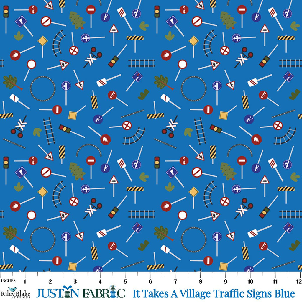 It Takes A Village Traffic Signs Blue Yardage by Jennifer Long | Riley Blake Designs with scattered traffic signs on a blue background