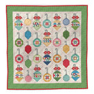 Decorating the Tree Quilt Pattern by Lori Holt with festive ornament blocks in red, green, and holiday prints