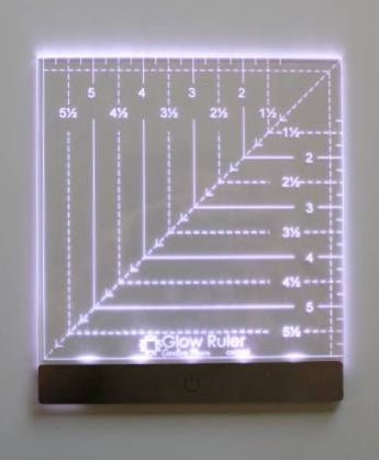 Close-up of Carolina Moore Glow Ruler showing clear measurement lines while glowing